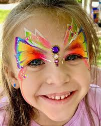 A fairy face painting on a child