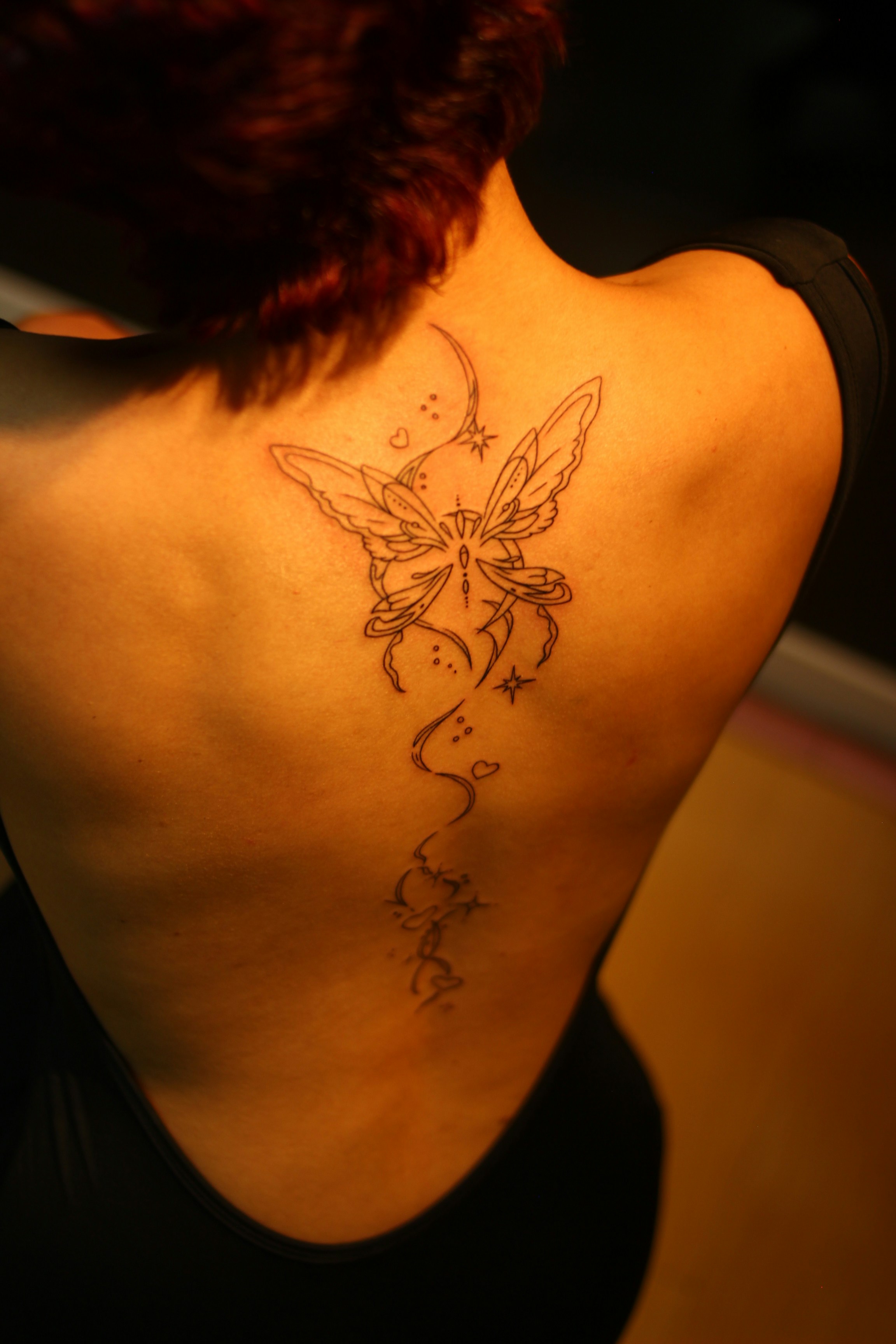 Fairy tattoo on a ladies back