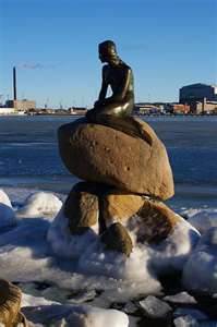 Little Mermaid Statue on a rock at a harbor entrance in Copenhagen