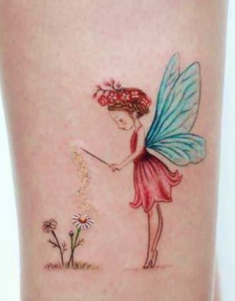 a pretty fairy arm tattoo