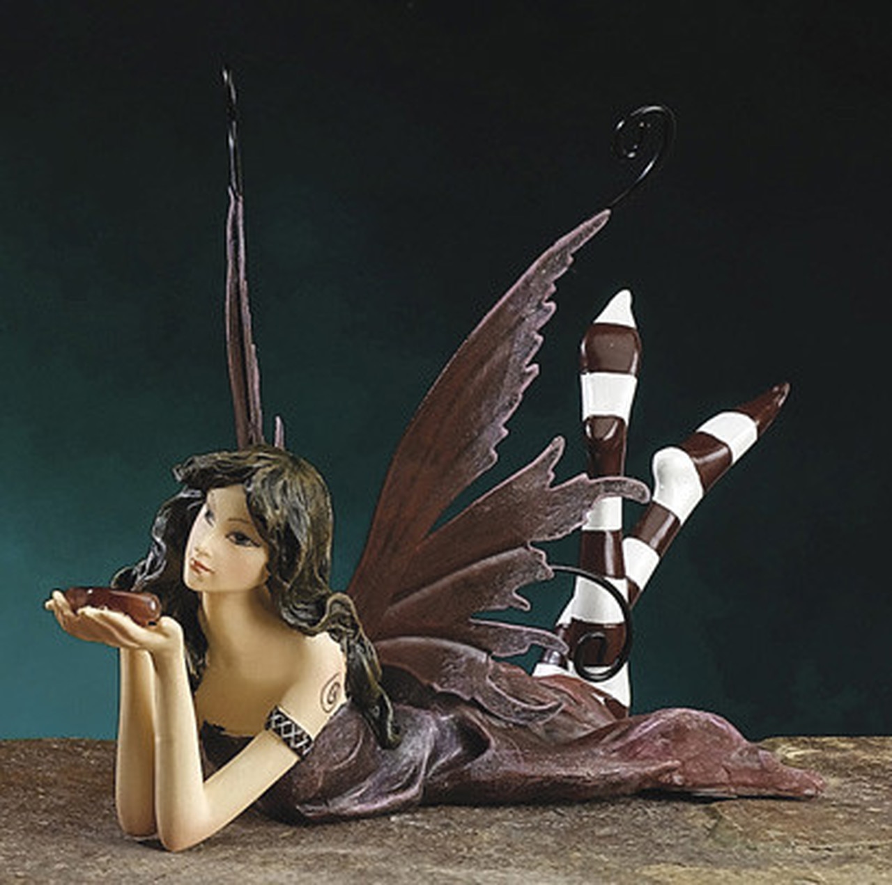 Fairy or Pixie holding a magic stone,
